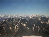 12 K2, Broad Peak, Gasherbrum IV, Gasherbrum I, Masherbrum On Flight From Islamabad To Skardu I can see a very large mountain in the hazy distance poking above the intervening mountains � K2! To the right of K2 is Broad Peak, the Gasherbrums, and to the right Masherbrum.